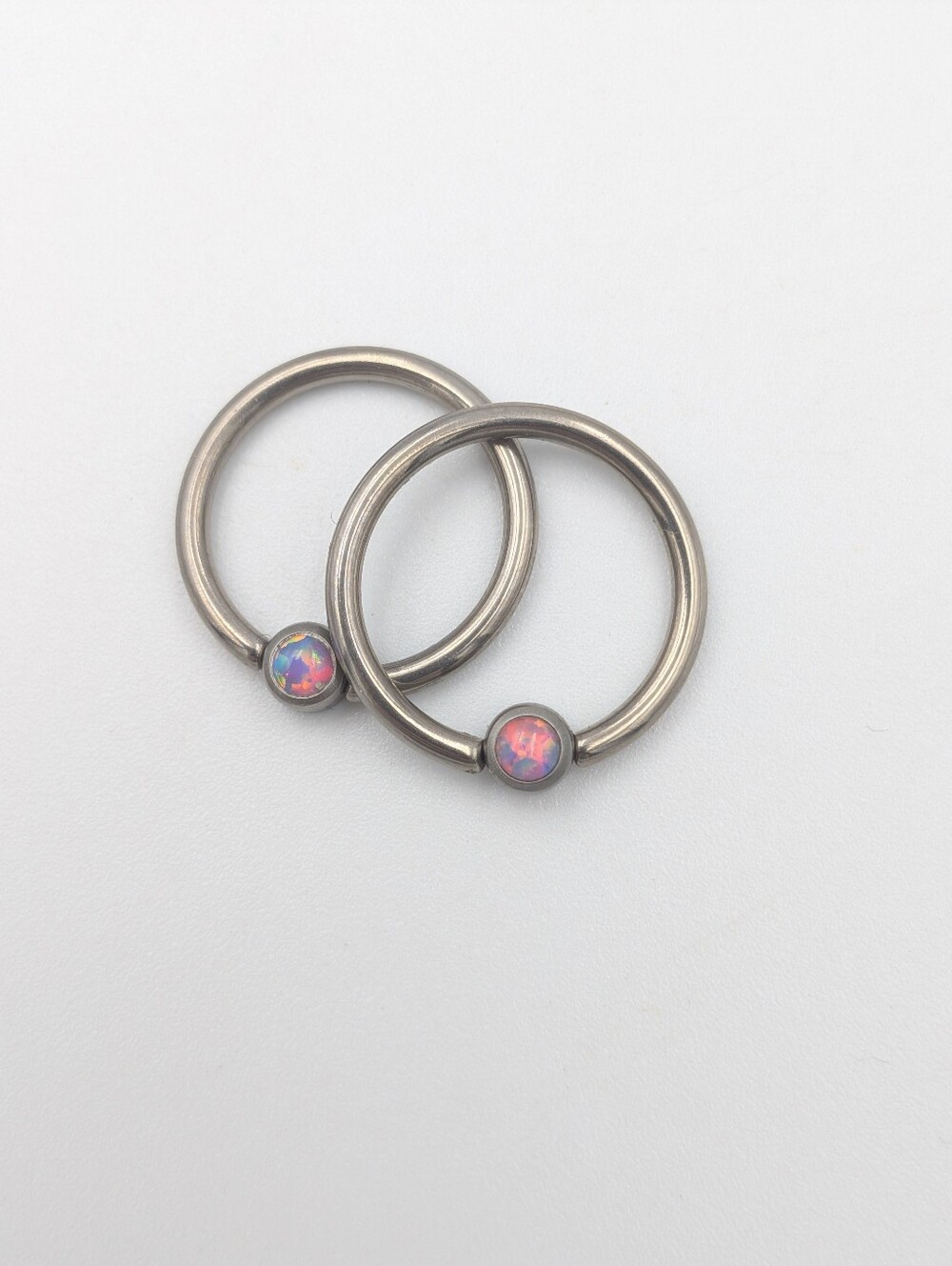 CBR captive ball rings faux opal titanium 14g (I think) earrings for piercings.